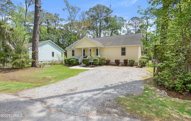 3010 Palmetto Ridge St, Beaufort, SC 29906 - view of front of house with a front yard, covered porch, and driveway