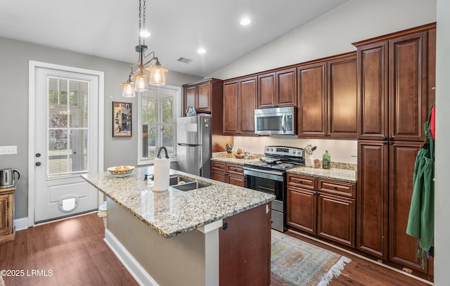 3010 Palmetto Ridge St, Beaufort, SC 29906 - kitchen with stainless steel appliances, an island with sink, dark wood-style flooring, and a sink