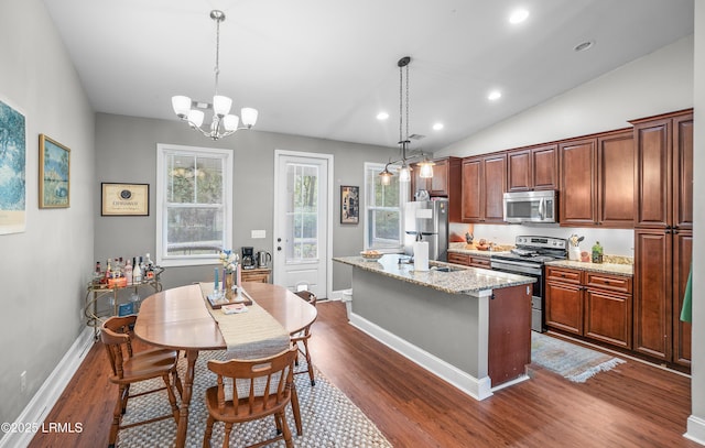 3010 Palmetto Ridge St, Beaufort, SC 29906 - kitchen with a chandelier, an island with sink, dark wood-style floors, and stainless steel appliances