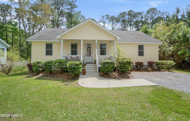 3010 Palmetto Ridge St, Beaufort, SC 29906 - view of front facade featuring roof with shingles, a porch, and a front lawn