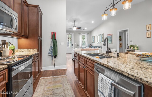 3010 Palmetto Ridge St, Beaufort, SC 29906 - kitchen with appliances with stainless steel finishes, a ceiling fan, light stone countertops, dark wood finished floors, and a sink