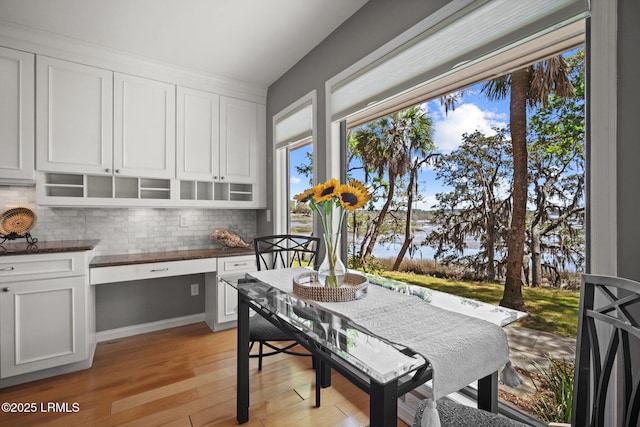 2009 Bluff Villas Rd, Saint Helena Island, SC 29920 - dining room featuring light wood finished floors and a water view