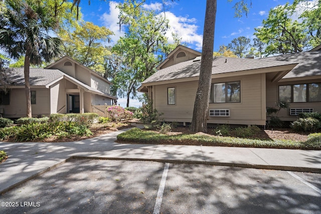 2009 Bluff Villas Rd, Saint Helena Island, SC 29920 - view of side of property featuring uncovered parking and a shingled roof