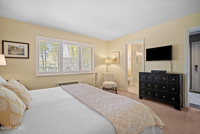 2009 Bluff Villas Rd, Saint Helena Island, SC 29920 - bedroom featuring carpet flooring, ensuite bath, a wall mounted AC, and a textured ceiling