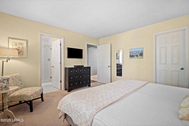 2009 Bluff Villas Rd, Saint Helena Island, SC 29920 - carpeted bedroom with baseboards, ensuite bath, and tile patterned flooring