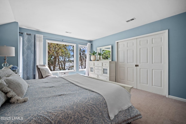 2009 Bluff Villas Rd, Saint Helena Island, SC 29920 - bedroom featuring carpet floors, a closet, and baseboards