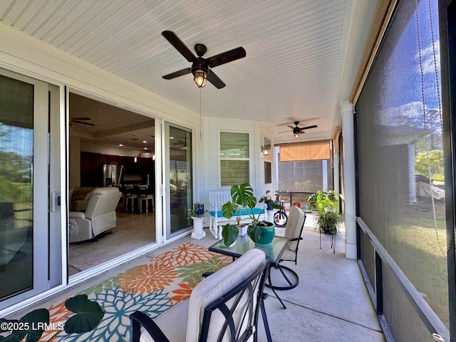 sunroom / solarium with ceiling fan