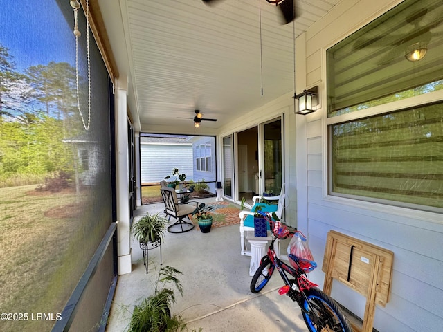 sunroom / solarium with ceiling fan