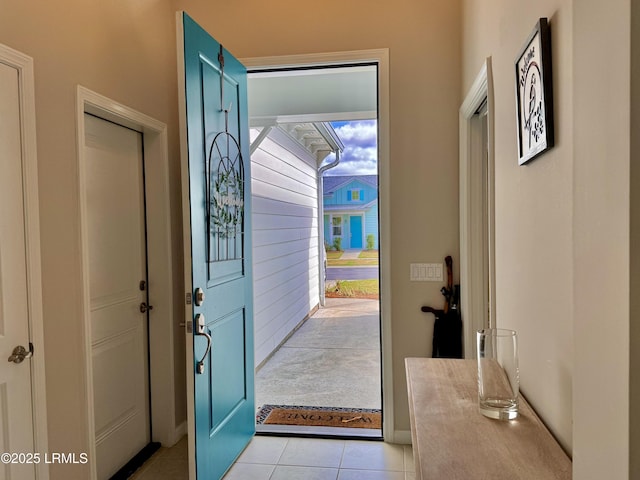 foyer featuring light tile patterned floors