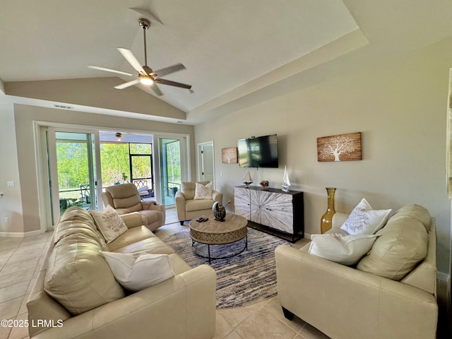 living room featuring light tile patterned floors, ceiling fan, high vaulted ceiling, and baseboards