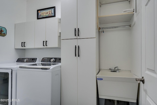 laundry room featuring a sink, cabinet space, and washing machine and clothes dryer