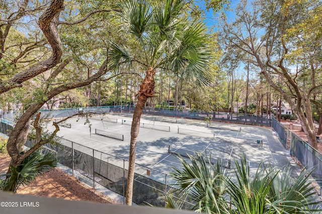 view of home's community with tennis court