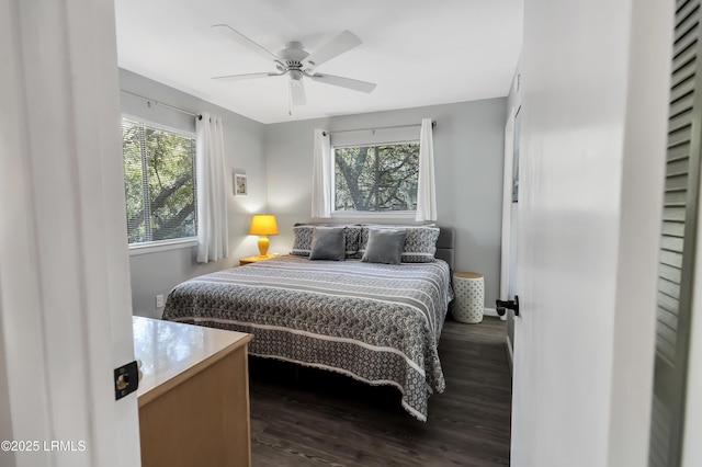 bedroom featuring ceiling fan and dark hardwood / wood-style flooring