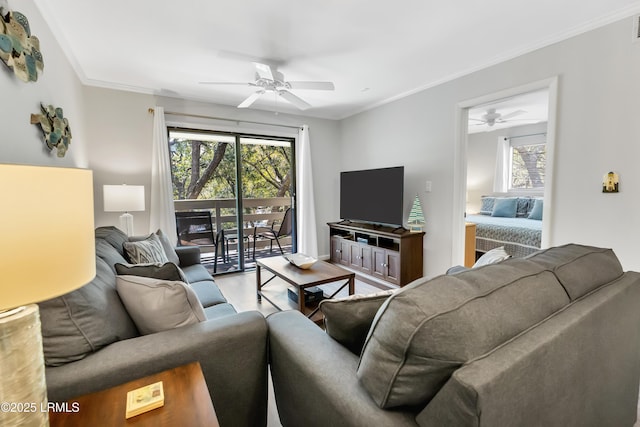 living room with hardwood / wood-style floors, ornamental molding, and ceiling fan