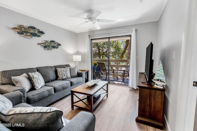 living room featuring crown molding, ceiling fan, and light hardwood / wood-style floors