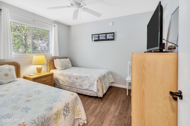 bedroom with wood-type flooring and ceiling fan