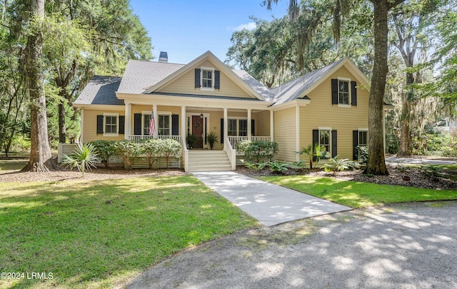 view of front of house featuring a front lawn and a porch