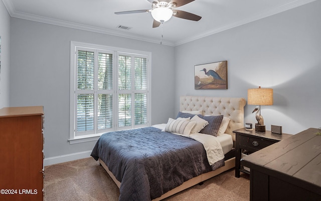 bedroom featuring crown molding, light colored carpet, and ceiling fan