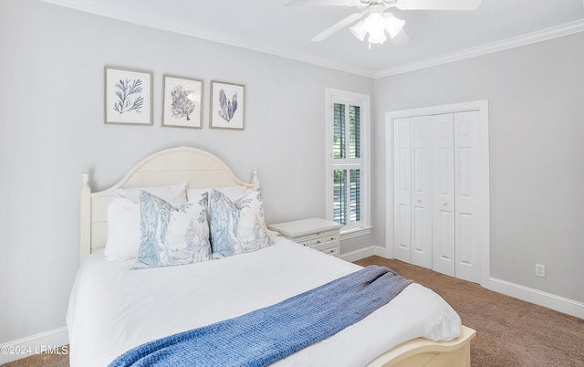 bedroom featuring ceiling fan, ornamental molding, carpet flooring, and a closet