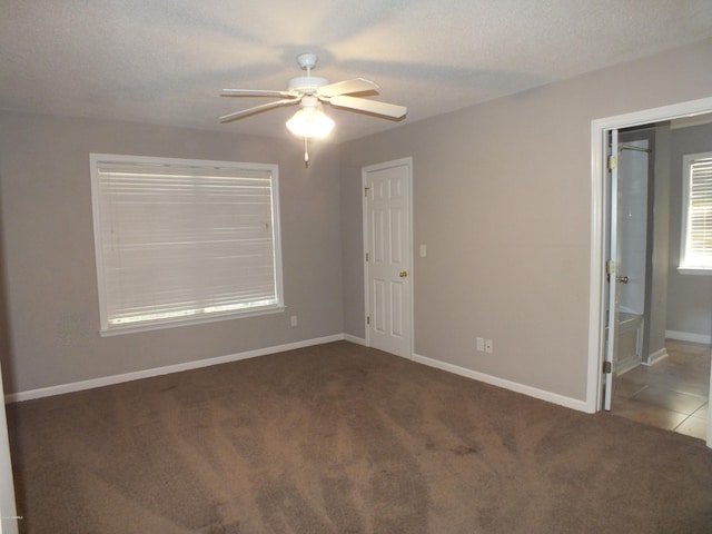 22 Ardmore Ave, Beaufort, SC 29907 - unfurnished bedroom with carpet floors, a ceiling fan, and connected bathroom