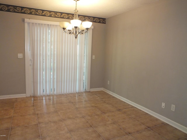 22 Ardmore Ave, Beaufort, SC 29907 - empty room with a chandelier and tile patterned floors