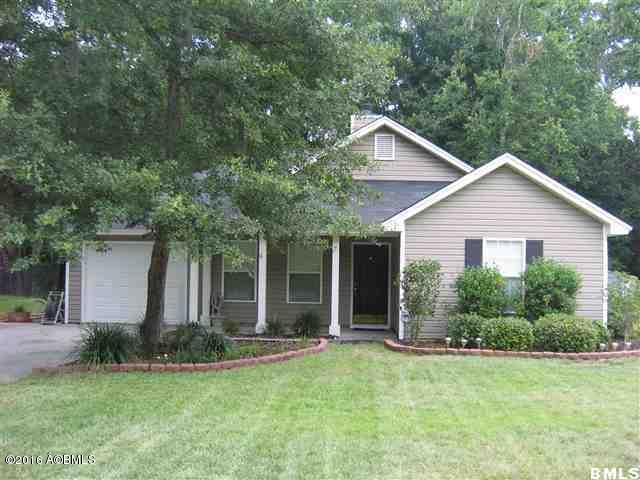 22 Ardmore Ave, Beaufort, SC 29907 - view of front of home with an attached garage, a front lawn, driveway, and a chimney