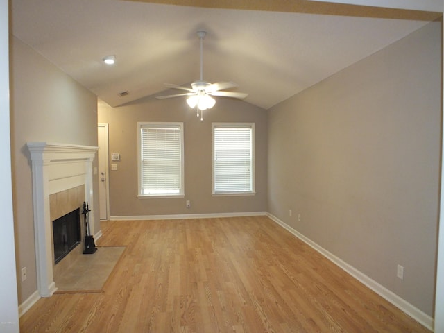 22 Ardmore Ave, Beaufort, SC 29907 - unfurnished living room with a ceiling fan, light wood-style flooring, a tiled fireplace, and lofted ceiling