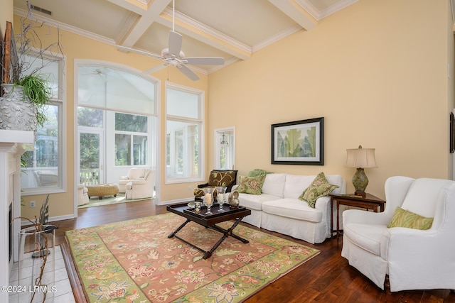 living room with beamed ceiling, ceiling fan, coffered ceiling, and dark wood-type flooring