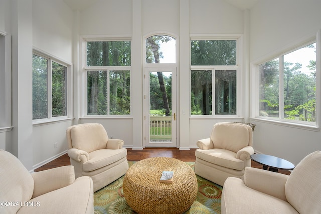 sunroom featuring lofted ceiling