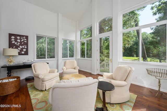 sunroom featuring vaulted ceiling