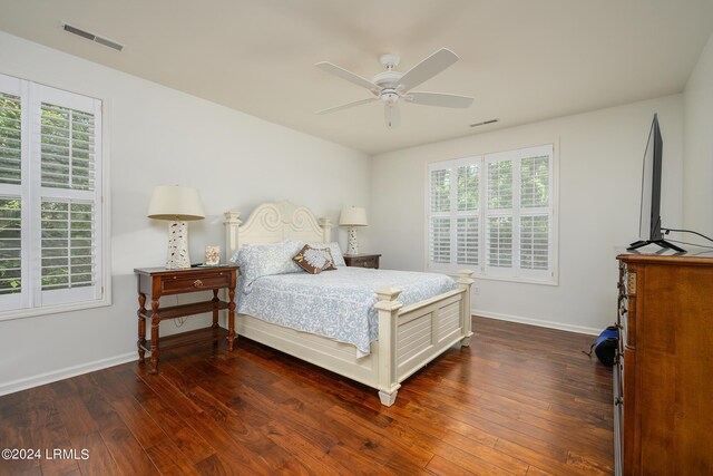 bedroom featuring dark wood-type flooring and ceiling fan