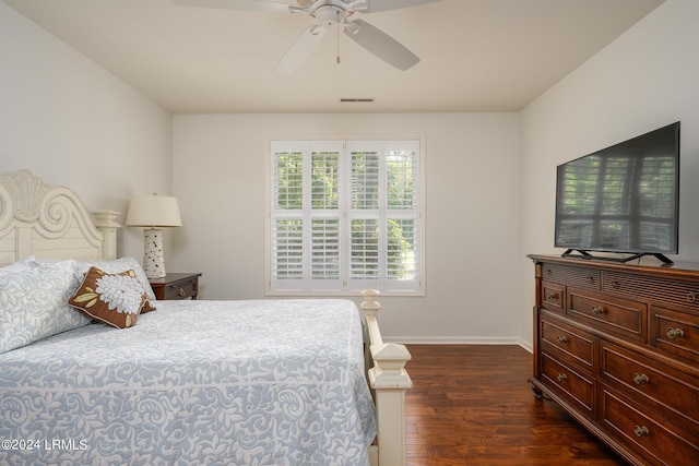 bedroom featuring dark hardwood / wood-style floors and ceiling fan