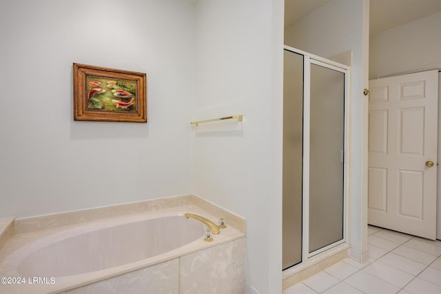 bathroom featuring shower with separate bathtub and tile patterned floors