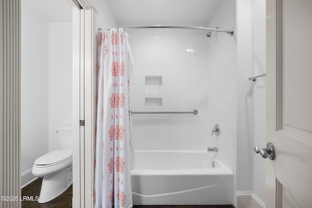 714 Island Cir E, Saint Helena Island, SC 29920 - full bath featuring toilet, shower / tub combo, baseboards, and wood finished floors