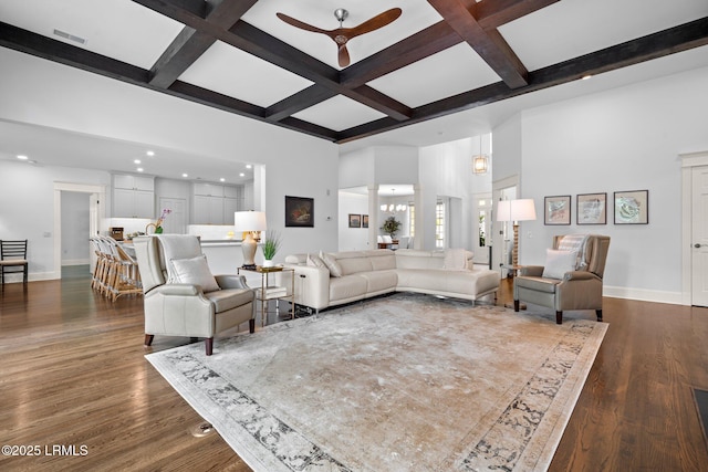 714 Island Cir E, Saint Helena Island, SC 29920 - living room featuring baseboards, a towering ceiling, coffered ceiling, beamed ceiling, and dark wood-style floors