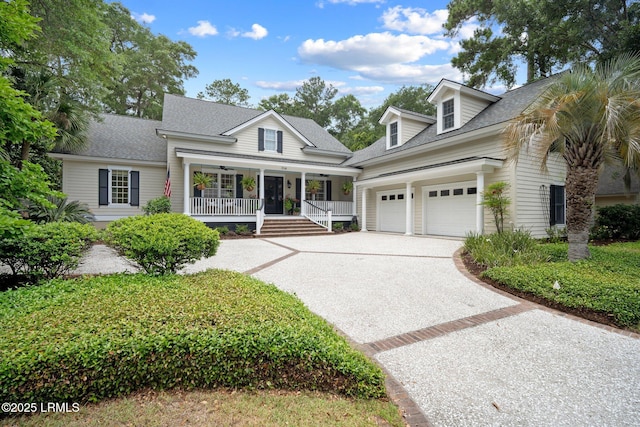 714 Island Cir E, Saint Helena Island, SC 29920 - view of front of home featuring covered porch, concrete driveway, a shingled roof, and an attached garage