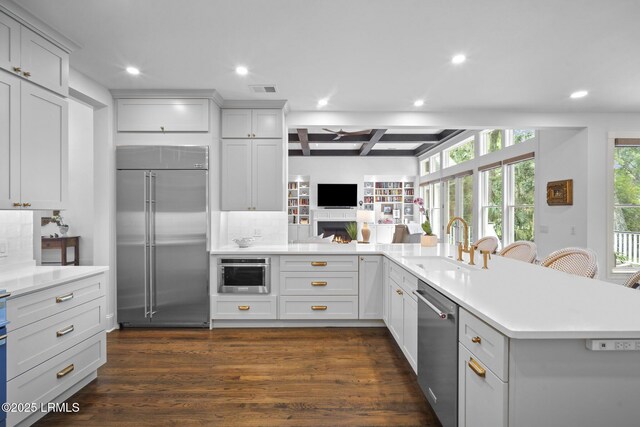 714 Island Cir E, Saint Helena Island, SC 29920 - kitchen with stainless steel appliances, recessed lighting, a sink, tasteful backsplash, and light countertops