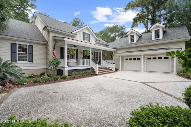 714 Island Cir E, Saint Helena Island, SC 29920 - view of front of house with a porch, driveway, roof with shingles, and a garage