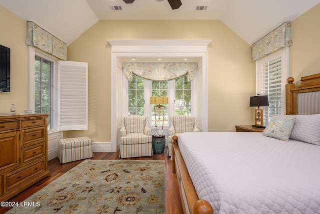 bedroom with lofted ceiling, dark hardwood / wood-style flooring, and ceiling fan