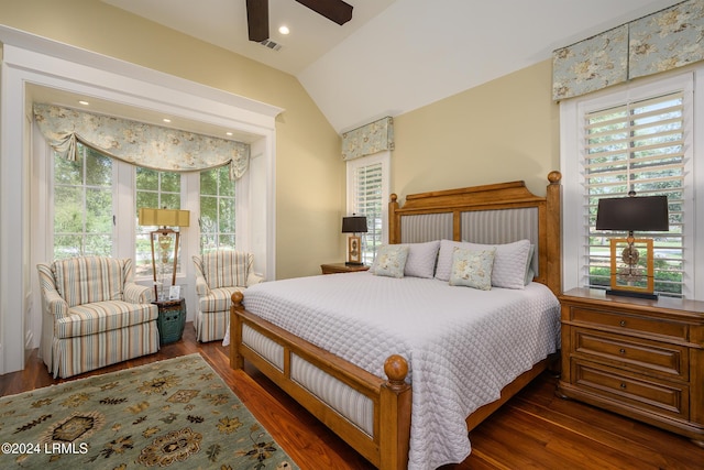 bedroom with ceiling fan, lofted ceiling, and dark hardwood / wood-style flooring