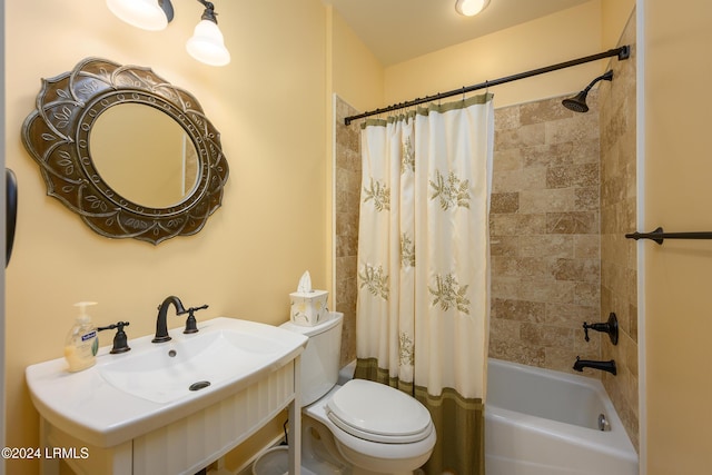 full bathroom with shower / bath combination with curtain, toilet, and sink