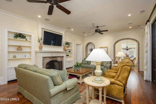 living room with dark wood-type flooring, built in features, and a fireplace