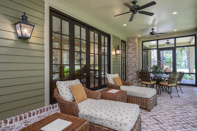 sunroom / solarium featuring wood ceiling