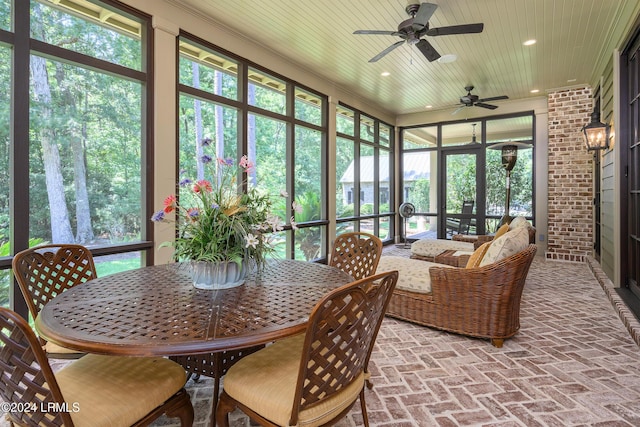 sunroom featuring wood ceiling