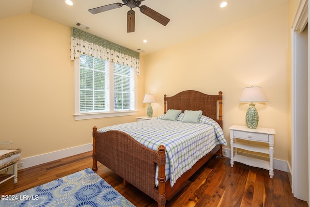 bedroom with dark wood-type flooring, ceiling fan, and vaulted ceiling