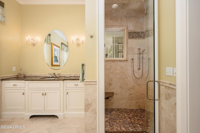 bathroom featuring an enclosed shower, vanity, and tile patterned flooring