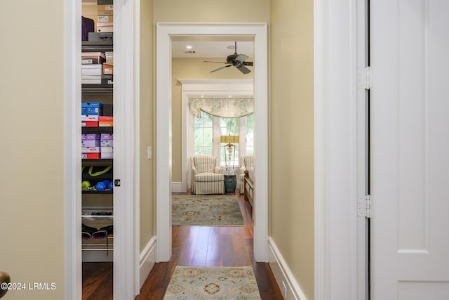 corridor with dark hardwood / wood-style floors