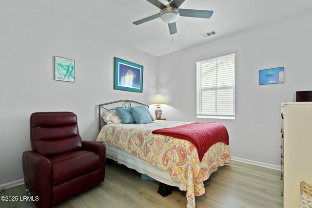 220 Sandbar Ln Unit 101, Hardeeville, SC 29927 - bedroom with baseboards, wood finished floors, and a ceiling fan