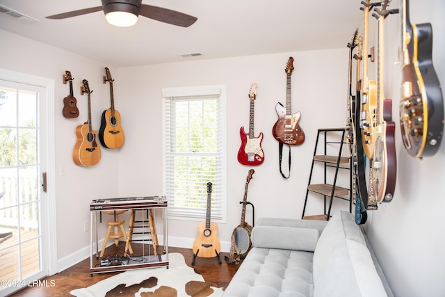 interior space featuring dark wood-type flooring and ceiling fan