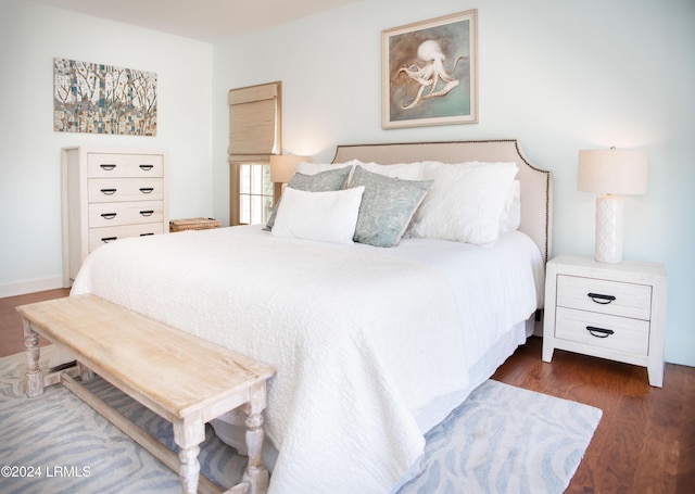 bedroom featuring dark hardwood / wood-style flooring